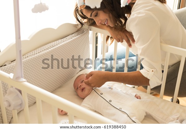 Mother Putting Baby Sleep Crib People Healthcare Medical Stock