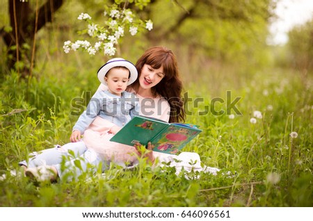 Similar – Reading stories Parenting