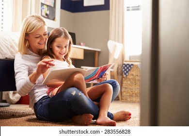 Mother Reading With Young Daughter