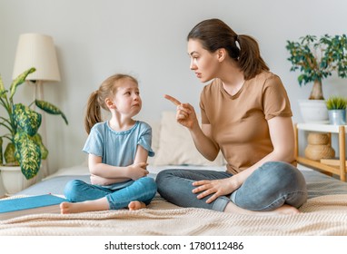 Mother Is Scolding Her Child Girl. Family Relationships