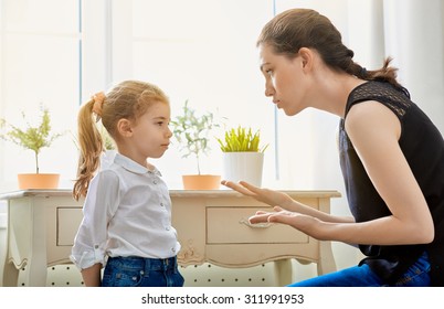 mother scolds her child - Shutterstock ID 311991953