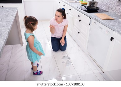 Mother Shouting To Her Daughter While Broken The Plate