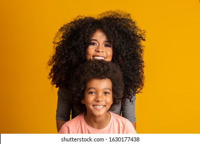 Mother and son with black power style hair. - Shutterstock ID 1630177438