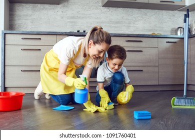 Mother and son are cleaning the apartment. - Powered by Shutterstock