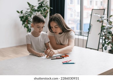 Mother   son drawing and pencils  Living room and modern interior  