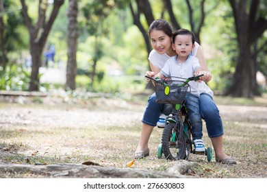 Mother and son enjoy activity together in the garden