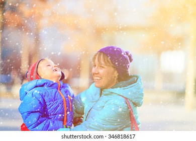 Mother And Son Enjoy First Snow, Family Winter In The City