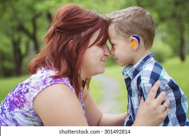 A Mother and son in forest having fun