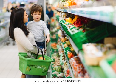 Mother with son at a grocery store - Powered by Shutterstock