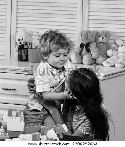 Similar – child girl playing checkers with her dad