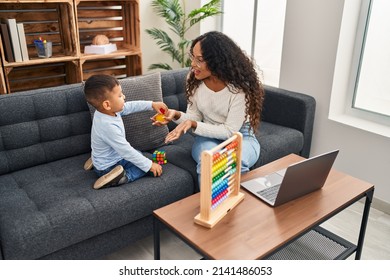 Mother and son having educational therapy at pedagogue center