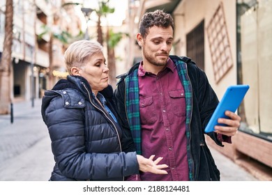 Mother And Son Having Video Call At Street