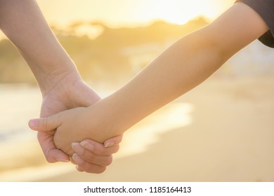 Mother And Son Holding Hands