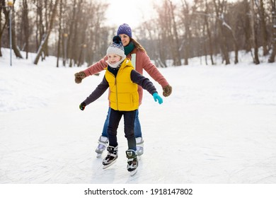 Mother And Son Ice Skating
