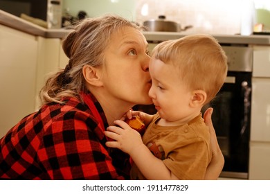 Mother And Son In Kitchen At Home