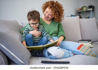 Mother And Son In Living Room Spend Some Quality Time. Mom And Son Reading Fairy Tales In Bed. Reading With Mum At Home. Little Boy And His Mother Are Reading A Book Together