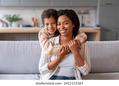 Mother Son Love. Happy Black Woman And Preteen Son Hugging At Home, Loving African American Family Of Two Mom And Male Kid Bonding And Enjoying Spending Time With Each Other, Copy Space - Powered by Shutterstock