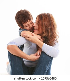 Mother And Son In A Loving Pose Isolated On A White Background.