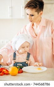 Mother And Son Making Salad At Kitchen Home.