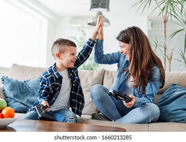 Mother And Son Playing And Having Fun At Home