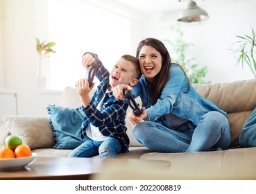 Mother And Son Playing And Having Fun At Home