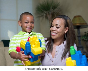 Mother And Son Playing With Legos