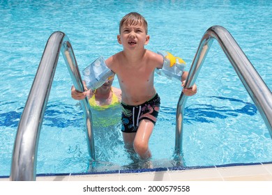 Mother son pool fun family game water. happy smiling