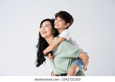 mother and son posing on a white background - Powered by Shutterstock