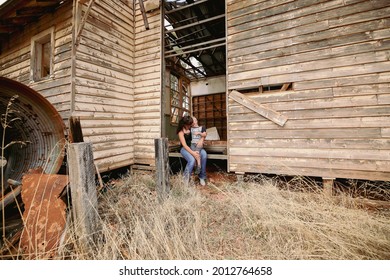 Mother And Son Sharing Loving Hug In Old Abandoned Run Down School