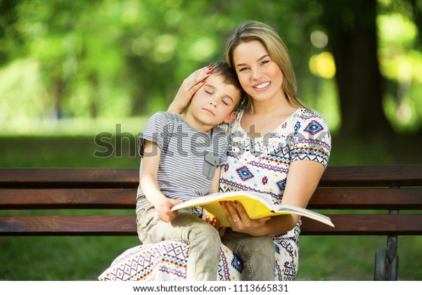 Mother Son Sitting On Bench Park Stock Photo Edit Now 1113665831