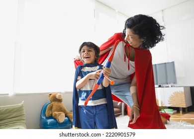 Mother and son in superhero costumes - Powered by Shutterstock