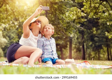 Mother With Son Take A Selfie Photo