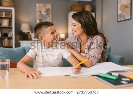Mother and son talking while doing homework