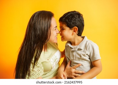mother and son touching their noses