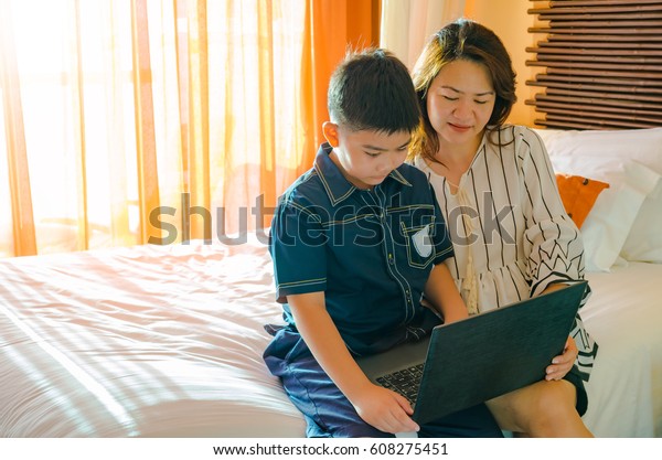 Mother Son Using Laptop Computer Together Royalty Free