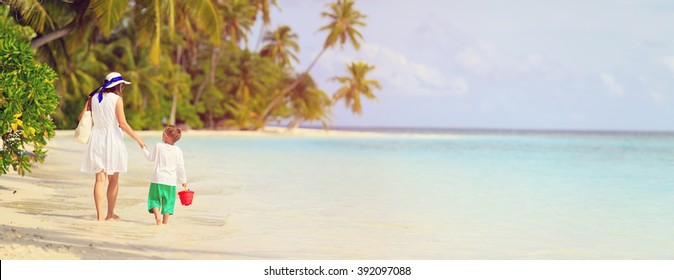 Mother And Son Walk On Summer Beach