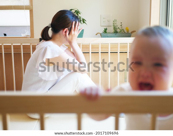 A mother is\
stressed out because of baby\
crying