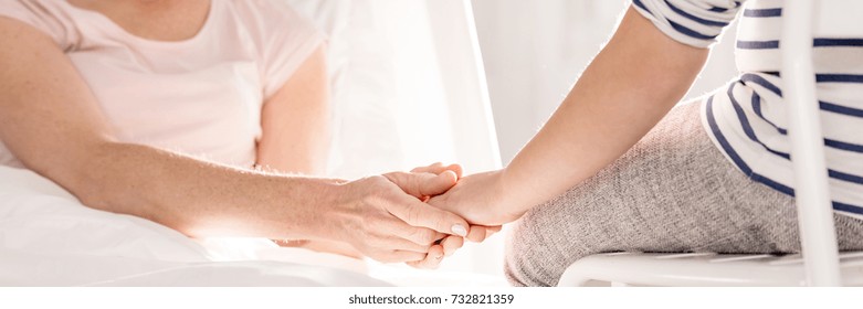 Mother Taking Hand Of Her Daughter