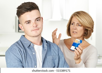 Mother Talking To Teenage Son About Dangers Of Smoking