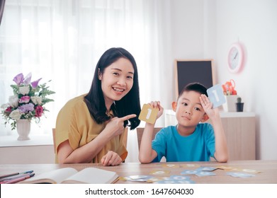 Mother Teaching Math Number Her Son At Home.Family Love And Education Concept