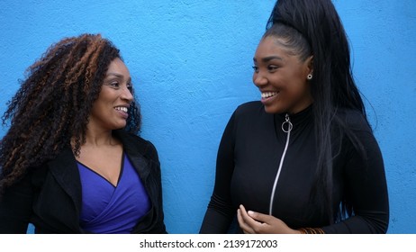 Mother And A Teen Daughter In Conversation Outside