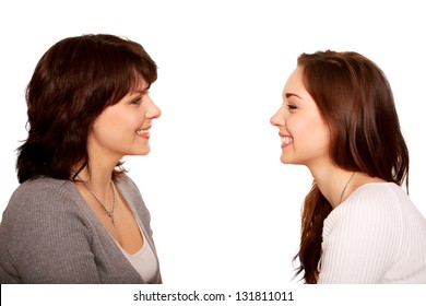 Mother And Teenage Daughter Talking And Laughing Together. Happy Family. A Side View. Isolated On White Background