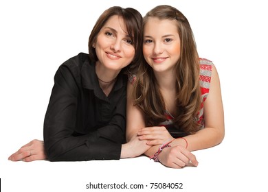 Mother And Teenager Daughter Lying Down Over White Background