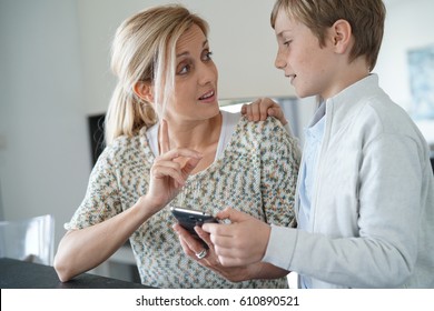 Mother Telling Her Son To Behave With Smartphone