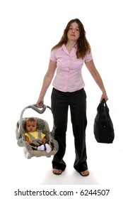 A Mother Toting Her Baby In His Carrier, Diaper Bag In The Other Hand.  Focus On Woman.