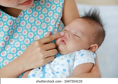 Mother Touching Baby's Nose. Baby Healthcare Checking.