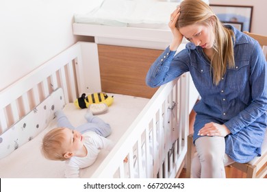 Mother trying to put her baby to sleep