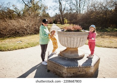 Mother with two daughters at Lednice park, Czech Republic.