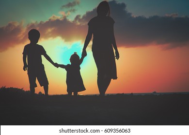 Mother Two Kids Walking Sunset Beach Stock Photo (Edit Now) 417838657