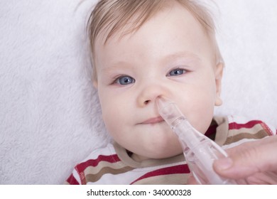 Mother Using Nasal Aspiration For Infant, Mucus Suction